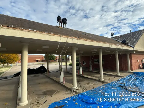Commercial bank branch drive-through canopy before roof replacement