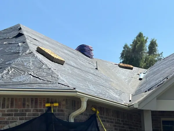 Residential roof prepped for new shingles above the patio