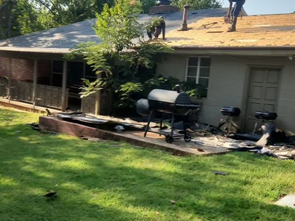 Side yard view of the roof during the reroof project