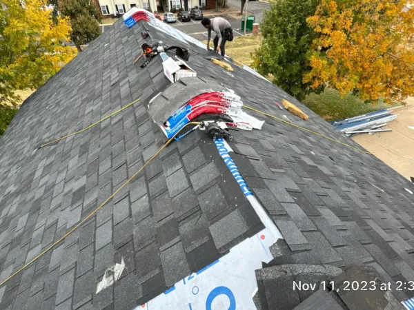 New shingles being installed on the commercial roof