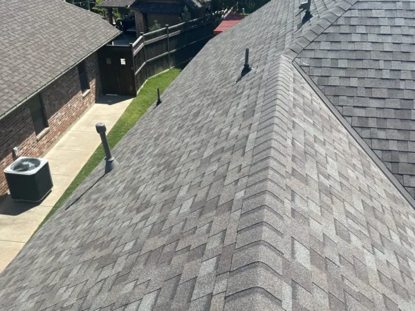Finished Driftwood shingle ridge on a residential roof