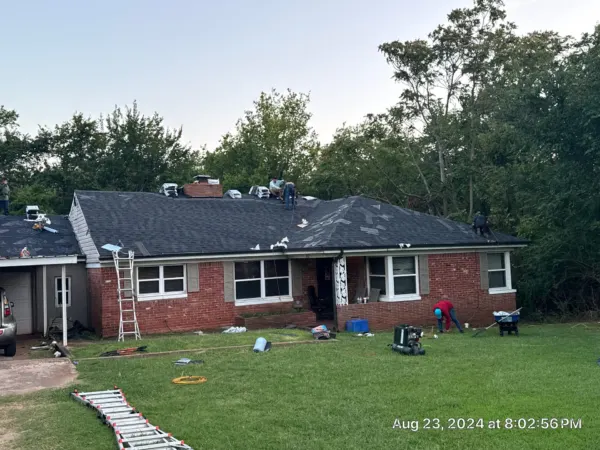 Finished IKO Granite Black shingle roof on a brick ranch home