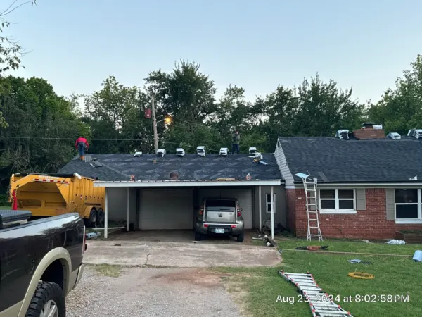 Completed roof replacement over the carport and front of the home