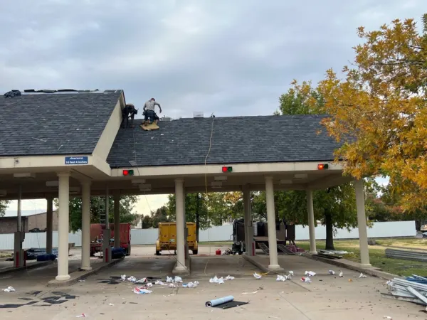Drive-through canopy roof during shingle installation