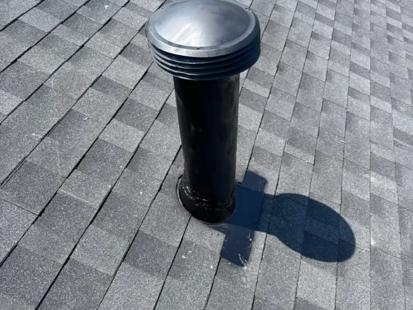 New pipe boot flashing on a freshly installed shingle roof