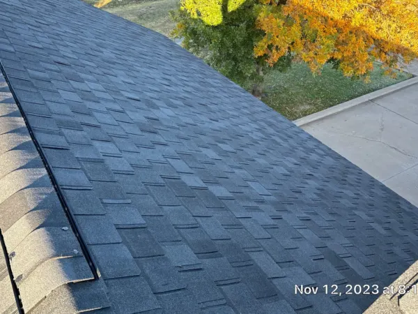 Completed architectural shingle roof slope on the commercial building
