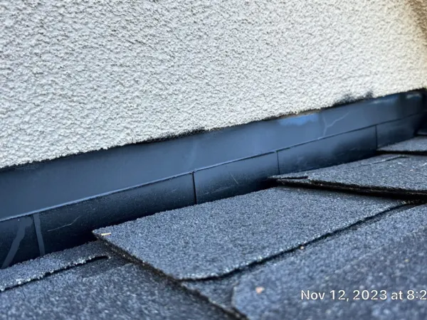 Finished shingle edge where the roof meets the wall