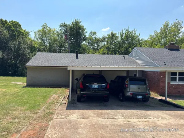 Front of the brick home after the completed roof replacement