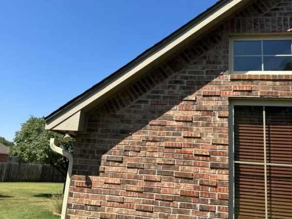 Gable and brick wall below the new roof
