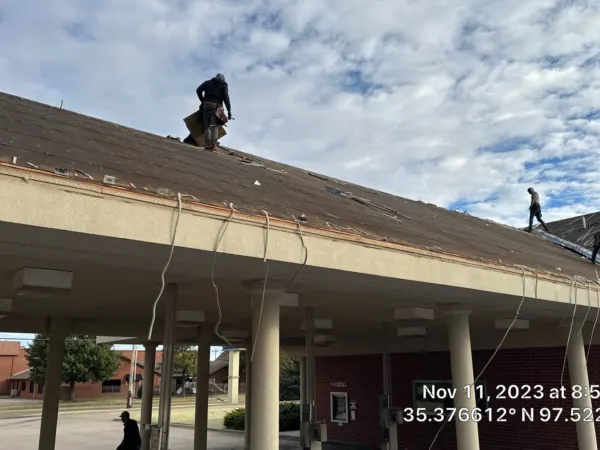 Commercial roof tear-off over the drive-through canopy