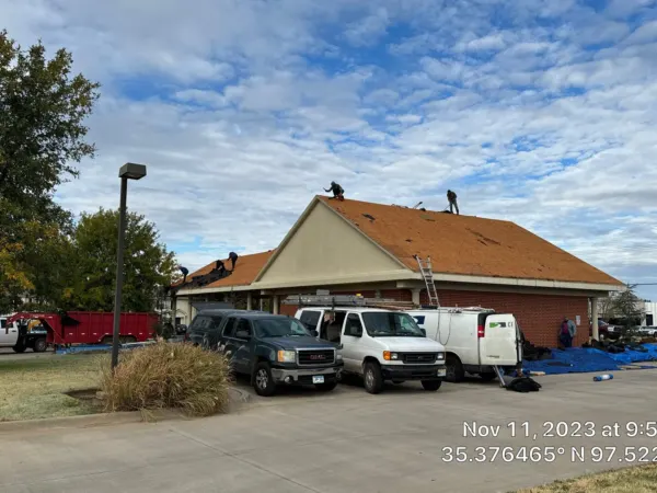 Commercial building with orange-tan roof before the replacement
