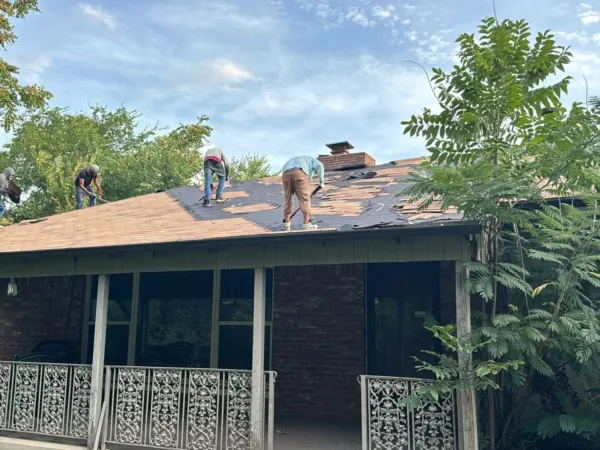 Covered patio and porch roof of the home before reroofing